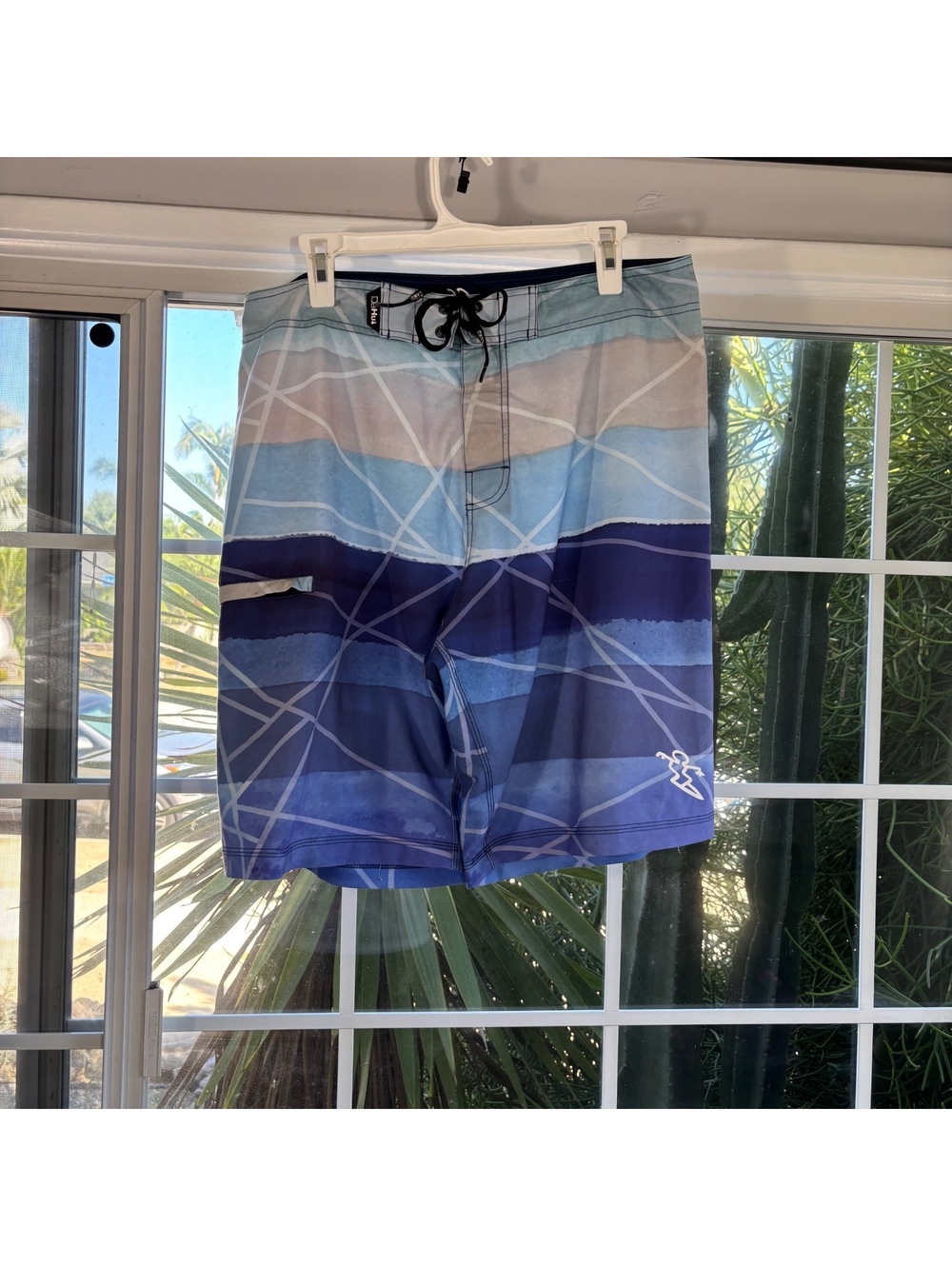 Blue striped Huk board shorts